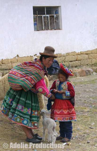 <b>Mother and Child, Peru</b><br/>&ldquo;Many of the locals wear traditional garb, with brilliantly coloured shawls...and, most incongruously, hats that resemble the bowler hats of some London banker.&rdquo;